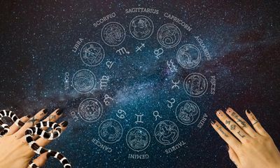 Hands surround zodiac wheel