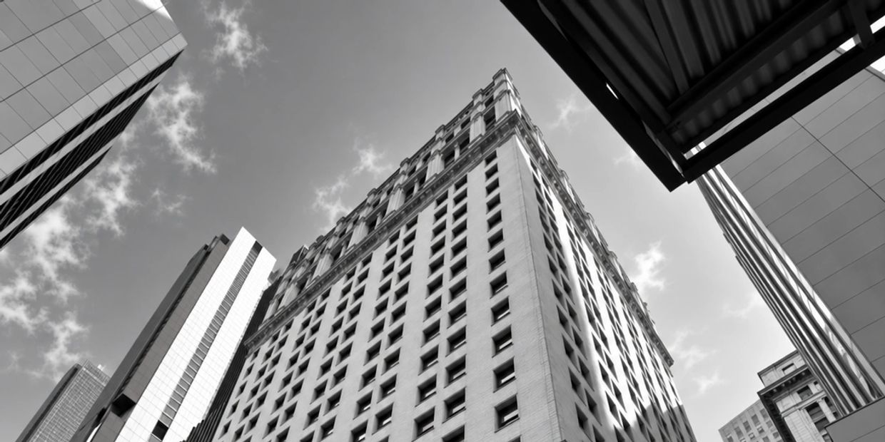 Looking up at a tall building in a city.