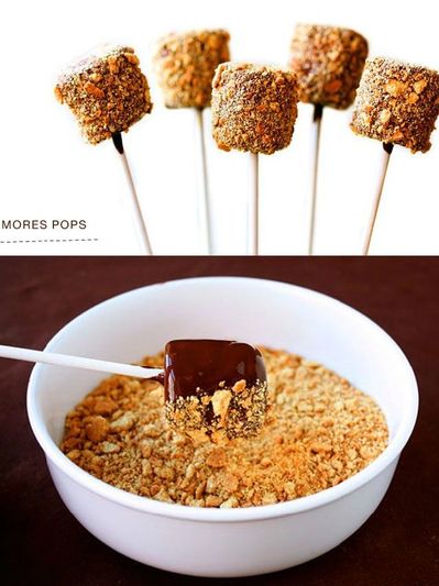 Chocolate-covered s'mores pops coated with crushed graham crackers.