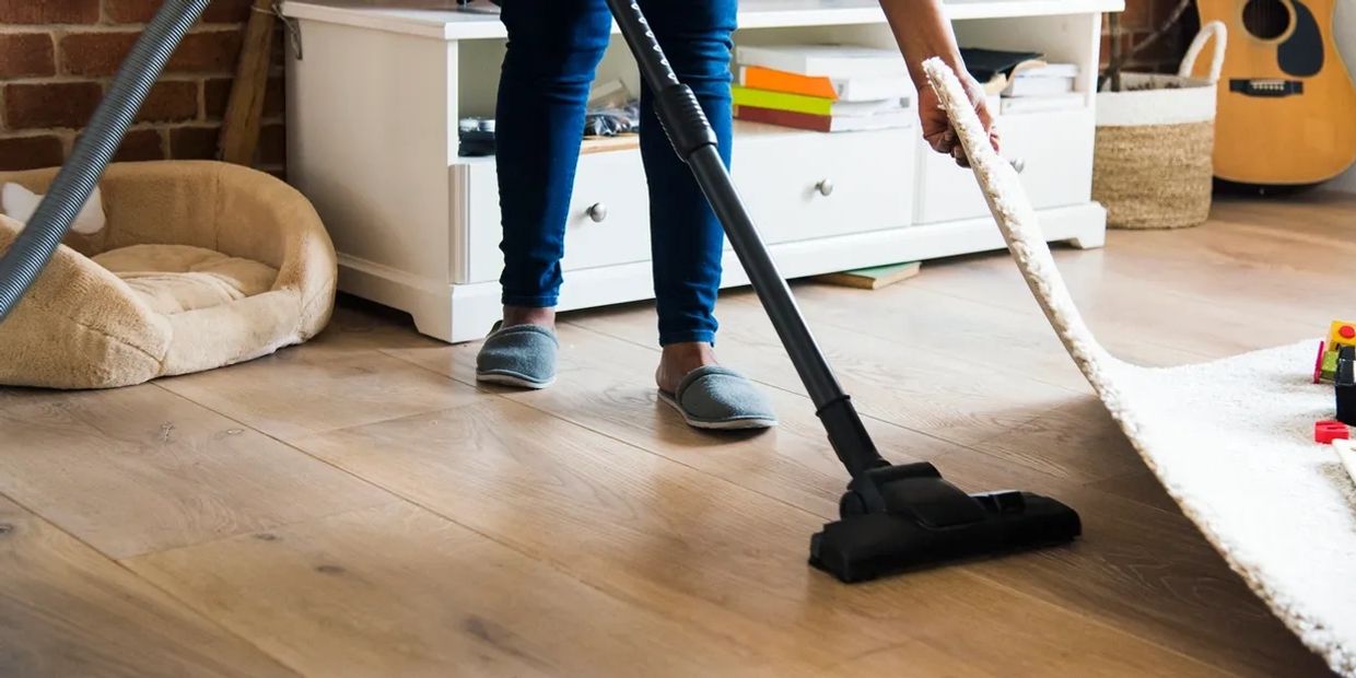 A person cleaning under the rag.