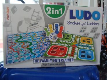 Board game set featuring Ludo and Snakes and Ladders for family fun.