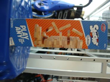 Jenga classic wooden block stacking game box displayed in a store.
