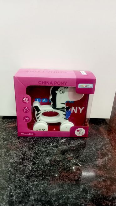 Kids Zone China Pony pull-along toy in pink packaging.