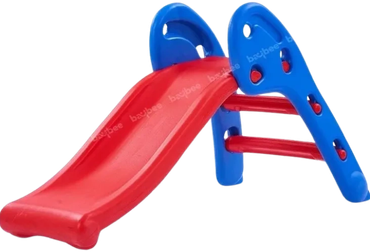 A small children's slide with a red sliding surface and blue handles.