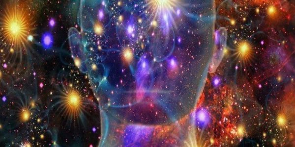 A cosmic, ethereal human face blended with colorful stars and galaxies.