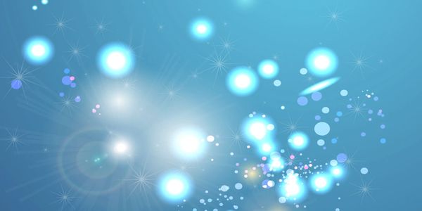 Abstract blue background with glowing light orbs and sparkles.