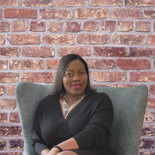 Woman sitting on a chair in an office 