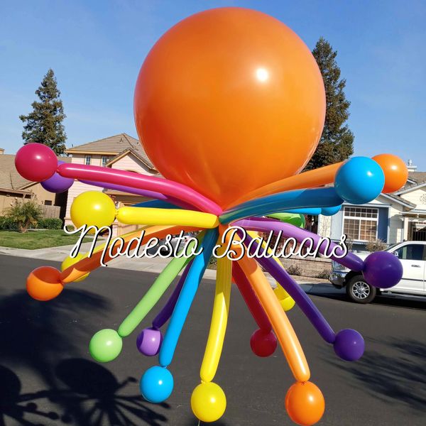 Colorful balloon octopus outdoors.