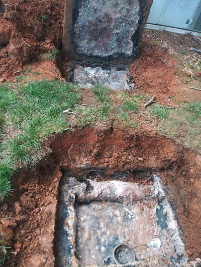 Full lid septic tank system opened for septic tank pumping and septic repairs 