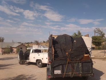 Dump trailer taking trash to the landfill. commercial and residential junk pickup service.   