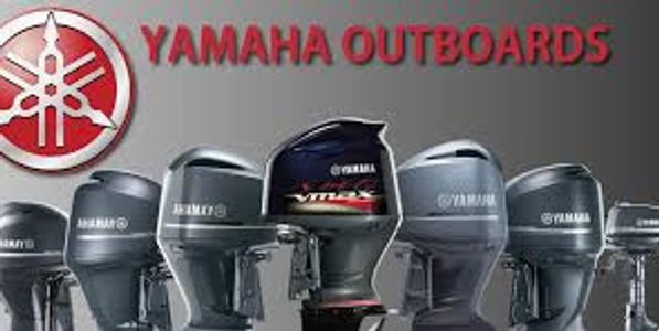 Various Yamaha outboard motors displayed in a row.