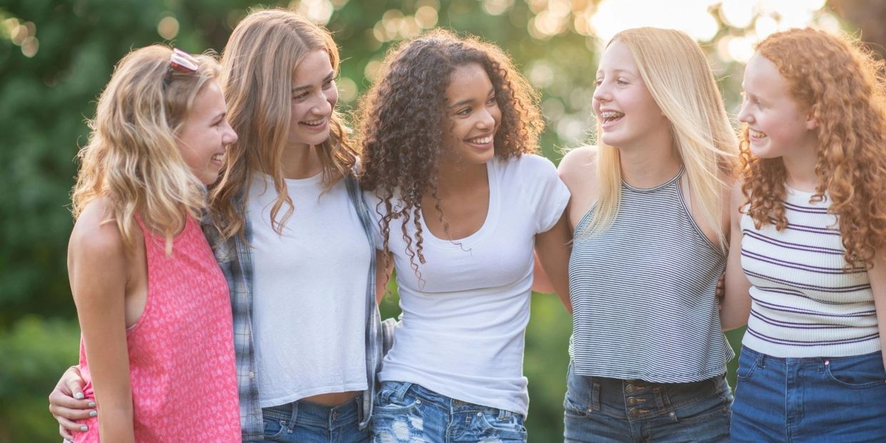 A scenic view of a mountain landscape with a clear blue sky and lush greenery.