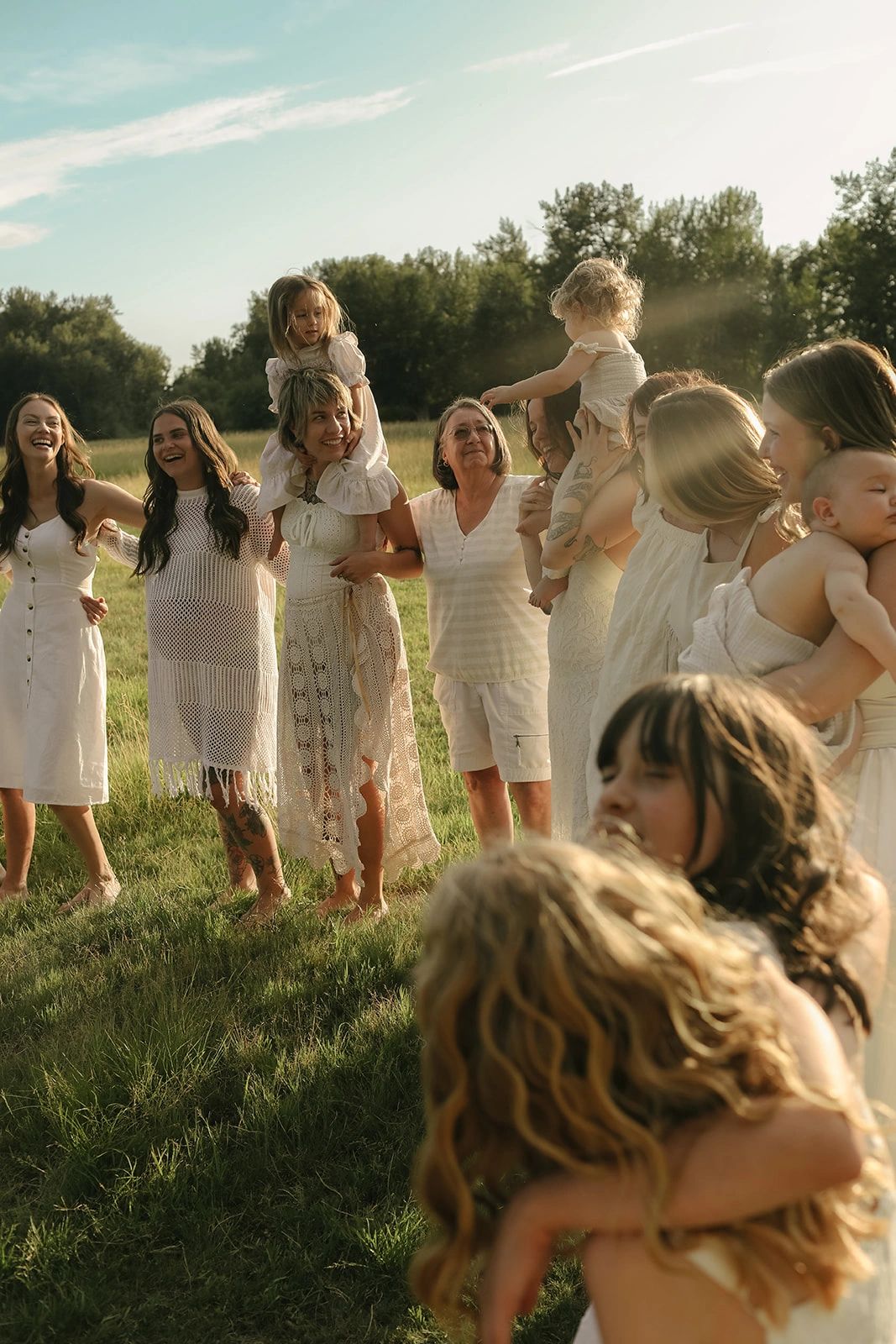 A joyful multi-generational group of women and children enjoying reflex integration.