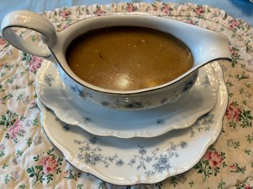 Gravy in a floral patterned gravy boat.