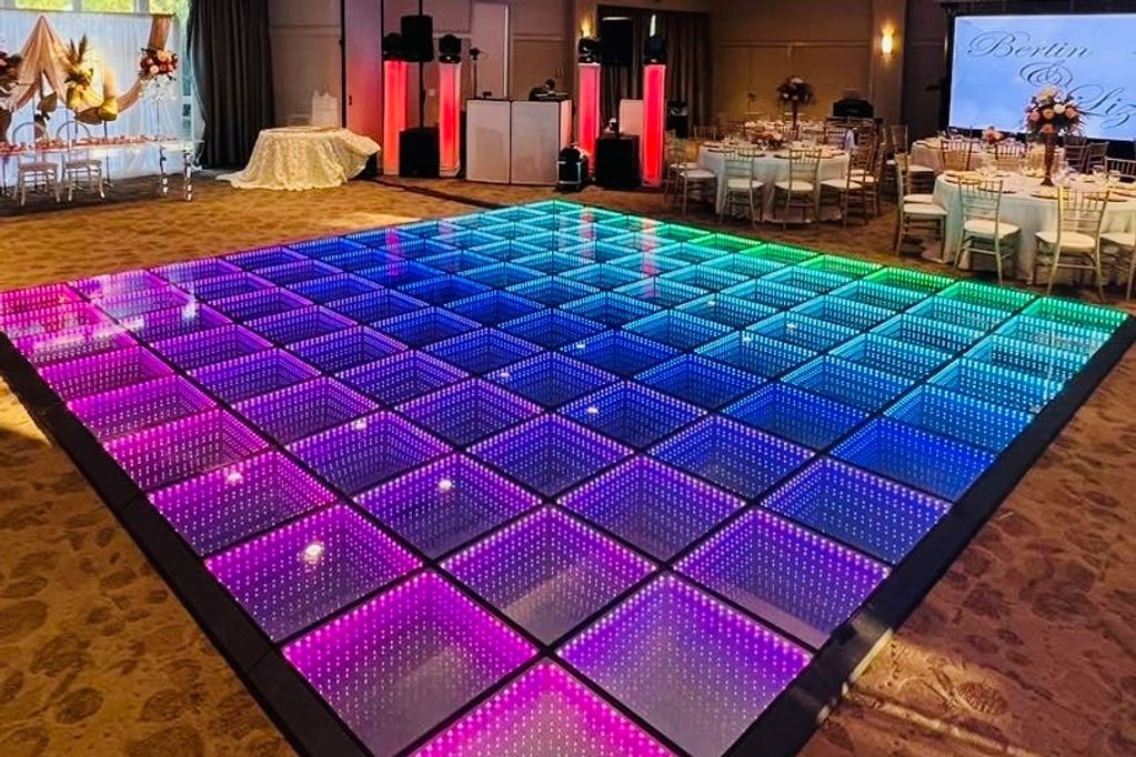 LED Dance floor set up with DJ at a party ready for guests to arrive. 