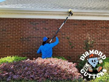 Technician restoring curb appeal. Diamond Gutters serves Washington, D.C., Maryland, and Virginia