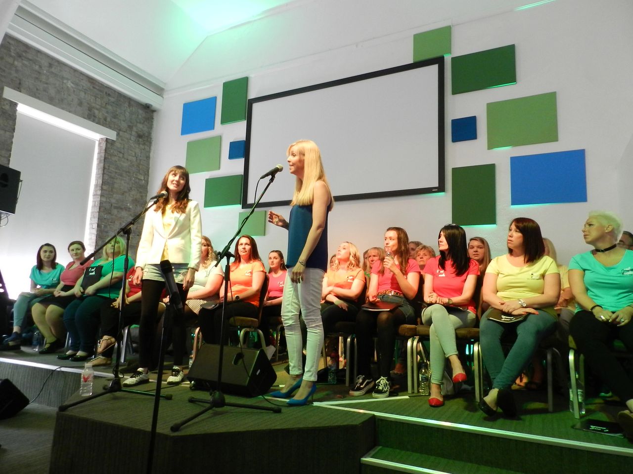 Jenna Fan singing with Alison George at a Local Vocals Pop Choir concert