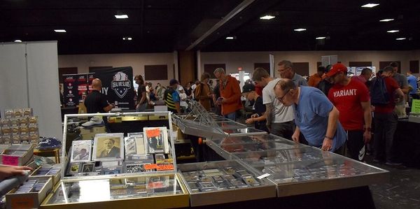 People browsing at a collectibles convention.