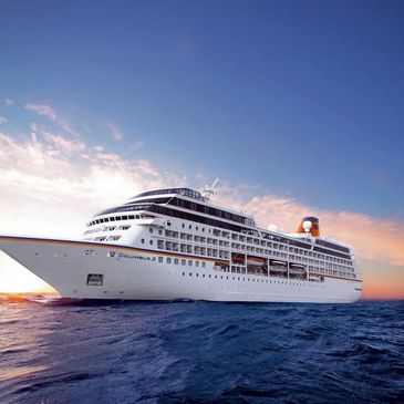 Cruise ship sailing at sunset on the ocean.