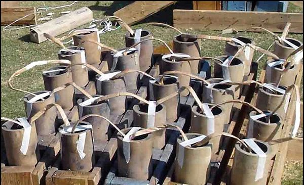 a volley of 25 3 inch firework shells fused and racked ready for an event