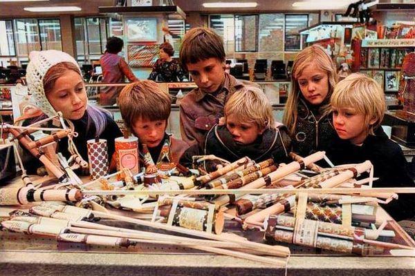 Children looking at fireworks in a shop c1969