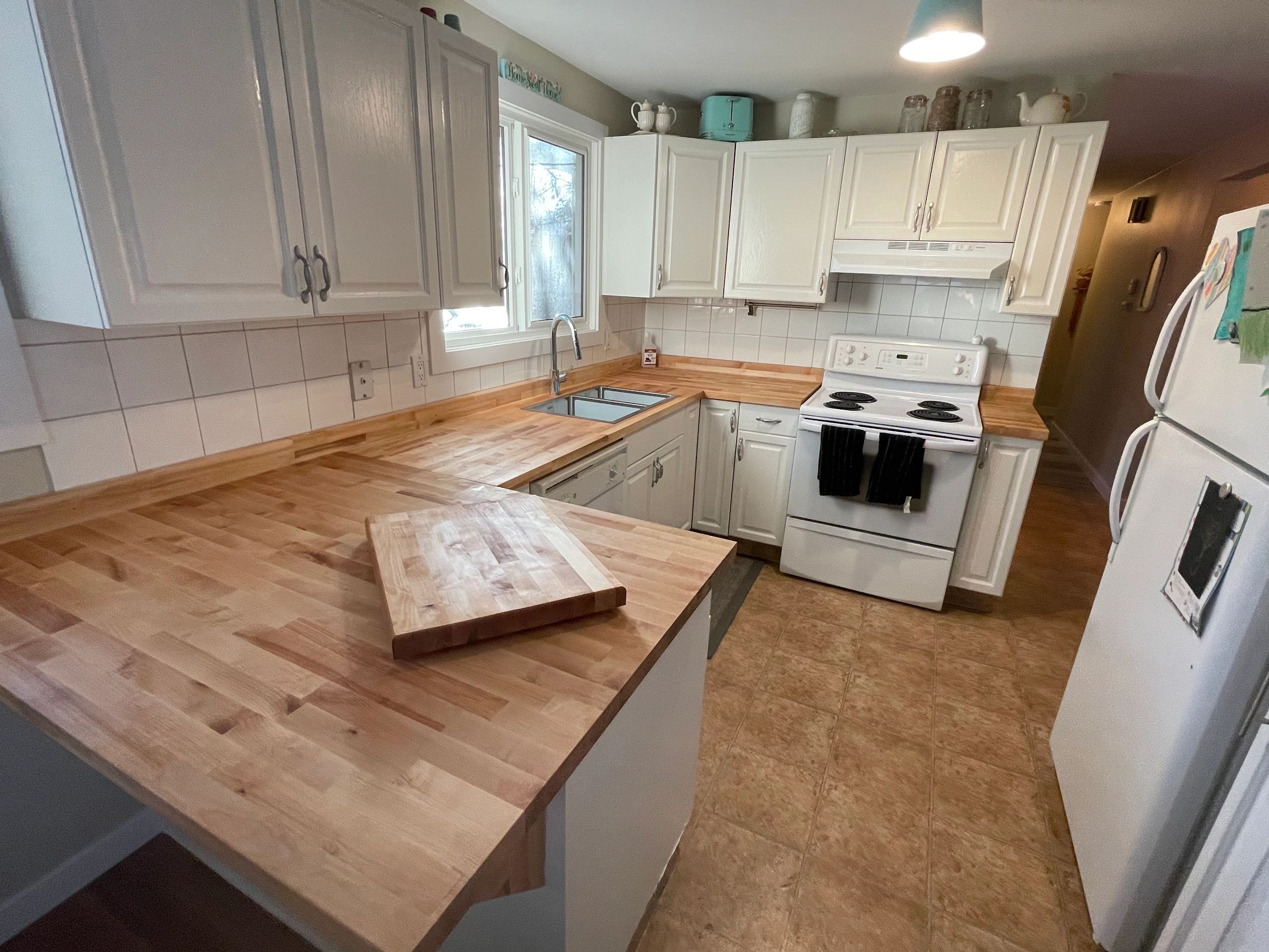 We updated this kitchen with a beautiful butcher block counter top.  Had some extra to make a cuttin