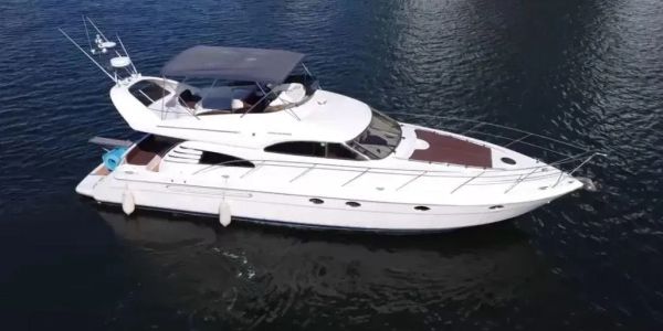 White luxury yacht on calm water.