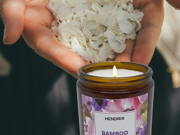 Lit Hendrik bamboo soy candle.