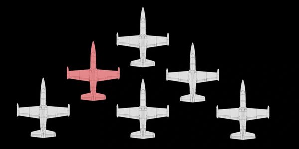 Six aircraft in formation with one highlighted in red.