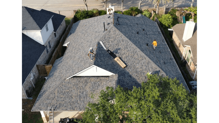 Aerial view of a completed architectural shingle roof on a Texas home