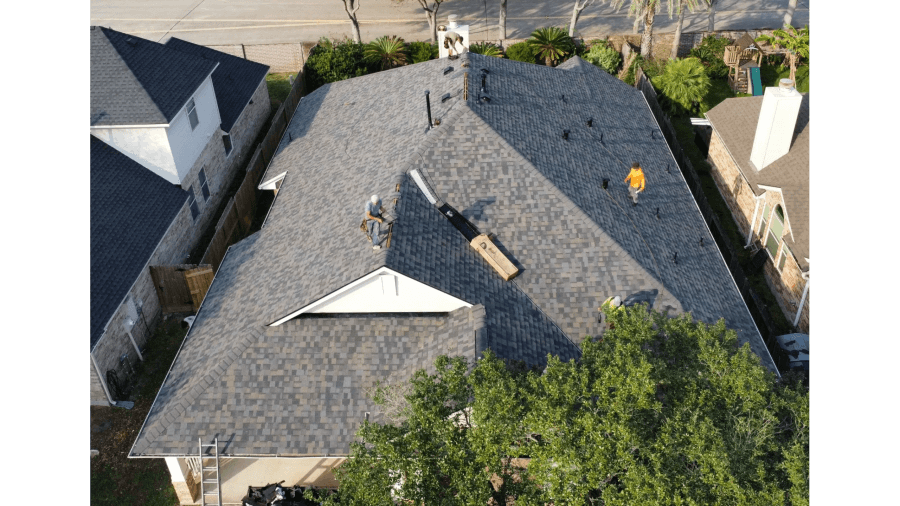 Aerial view of a completed architectural shingle roof on a Texas home