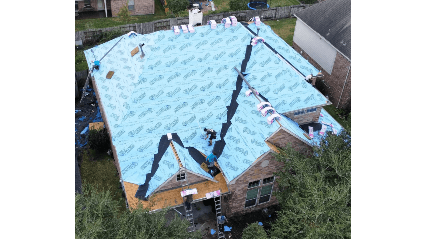 Roof deck covered in synthetic underlayment during a replacement