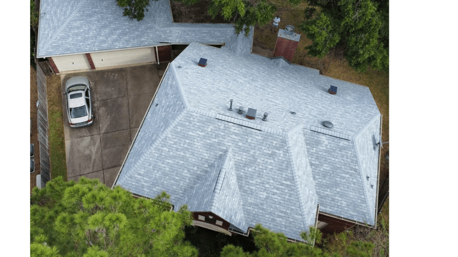 Light grey shingle roof on a home with a circular drive