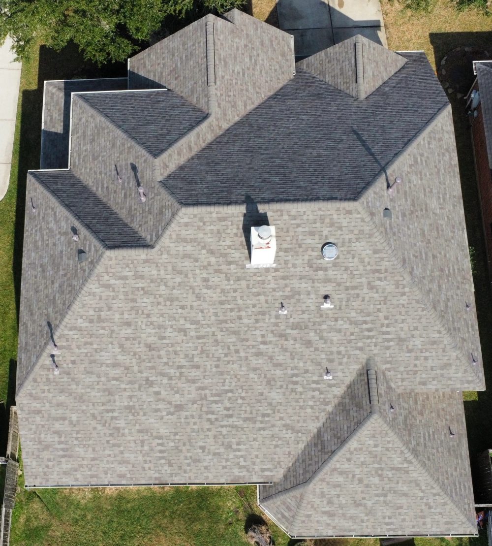 Aerial detail of new shingles and ridge line