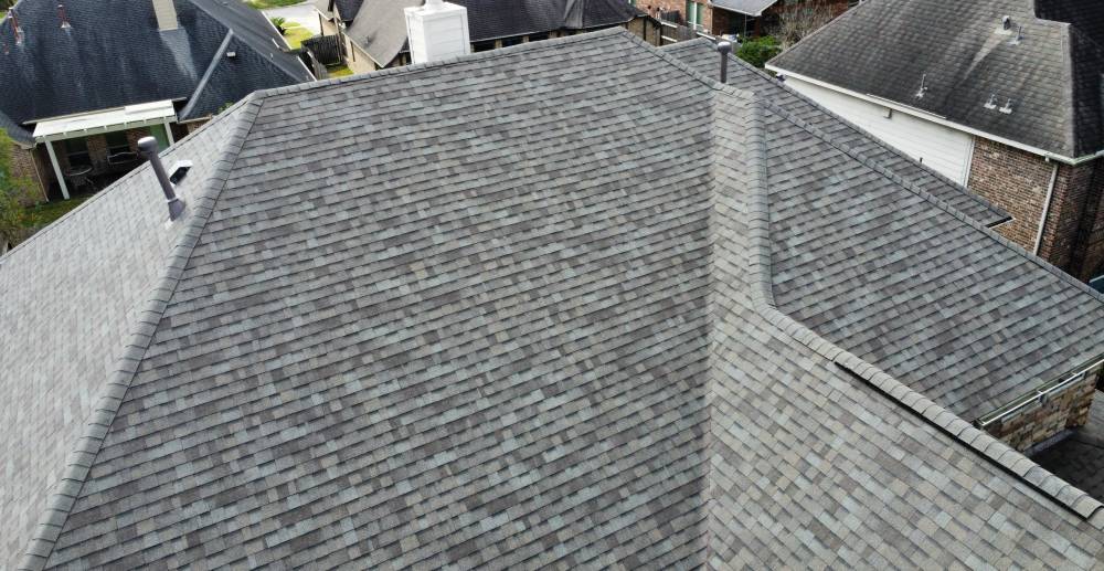 Drone photograph of a finished roof and surrounding property