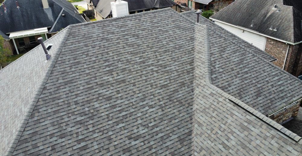 Drone photograph of a finished roof and surrounding property