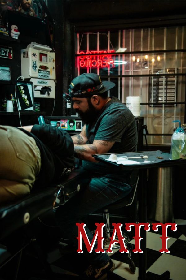 Matt tattooing a client's arm