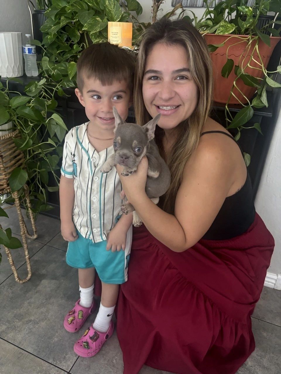 Family with French Bulldog puppy