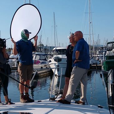 People at the edge of a yacht