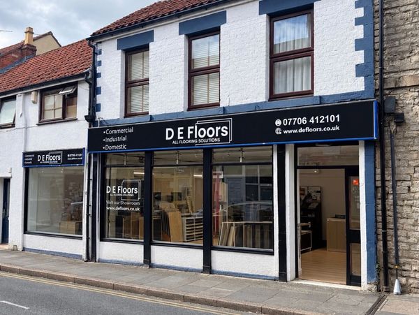 Storefront of D E Floors flooring solutions shop.