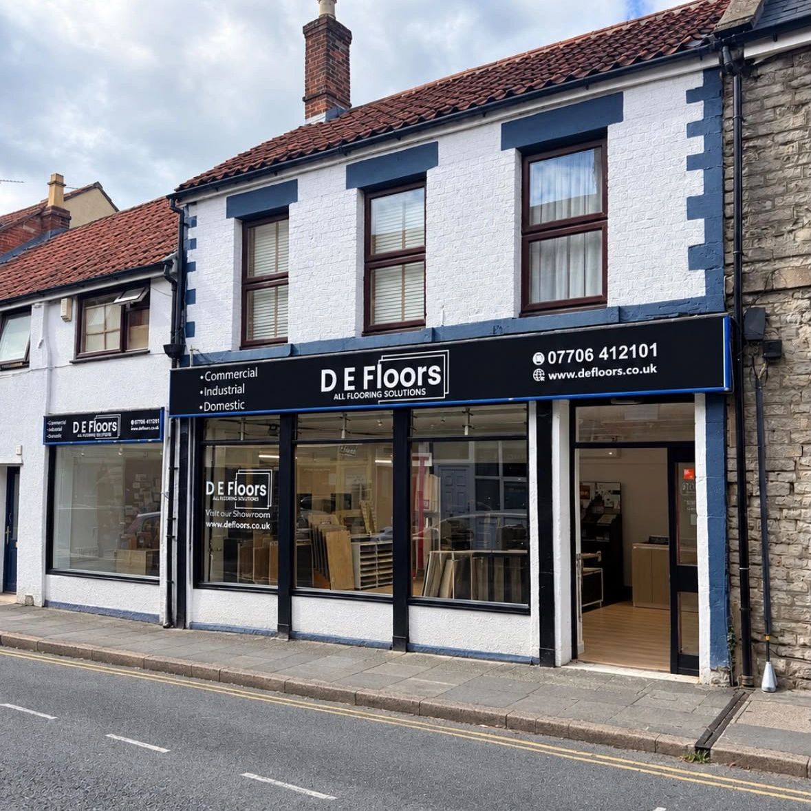 Storefront of D E Floors flooring solutions shop.