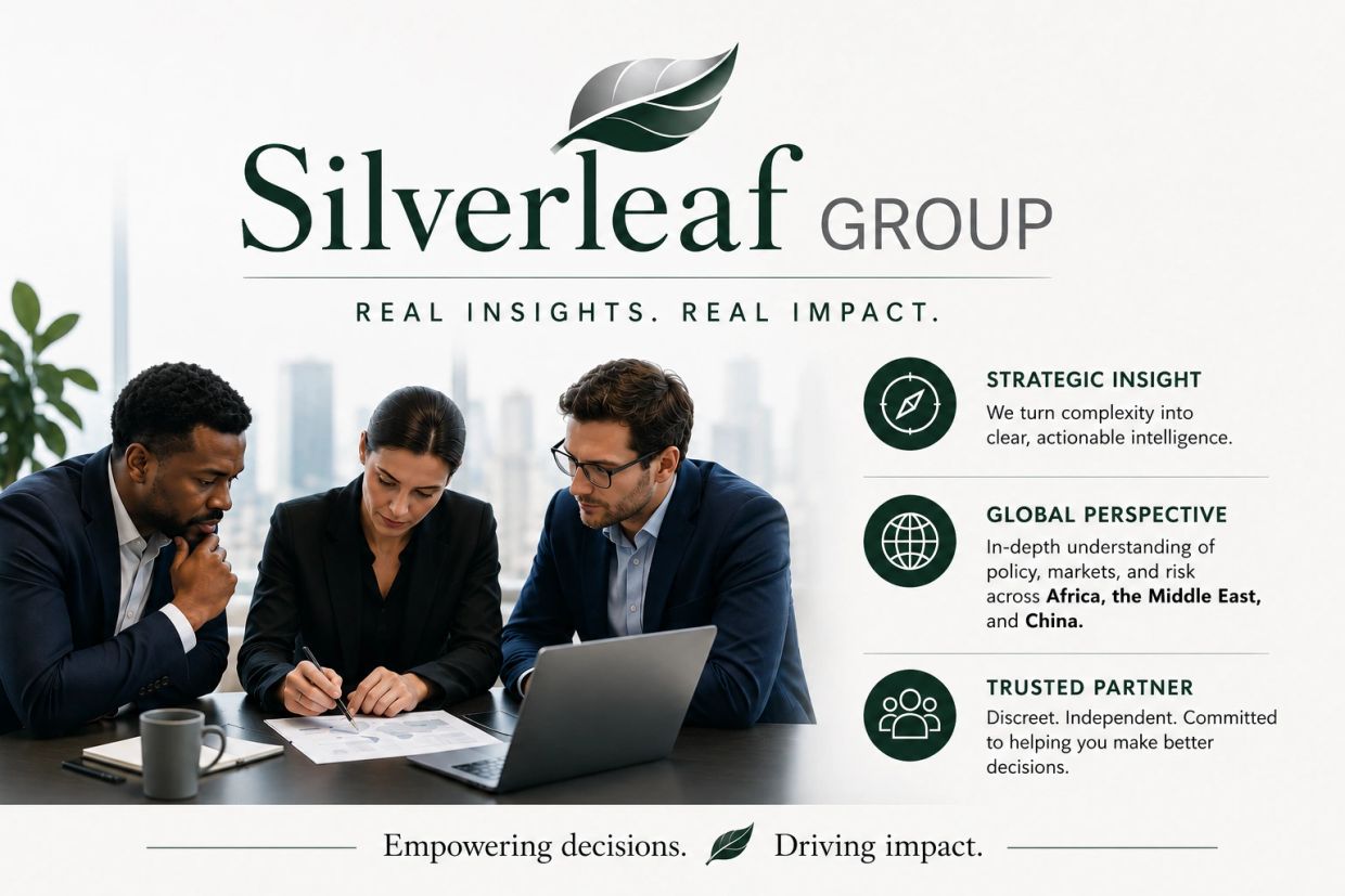 Three professionals collaborating over documents and laptop in a Silverleaf Group ad.