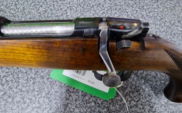 Close-up of a rifle's bolt action mechanism.