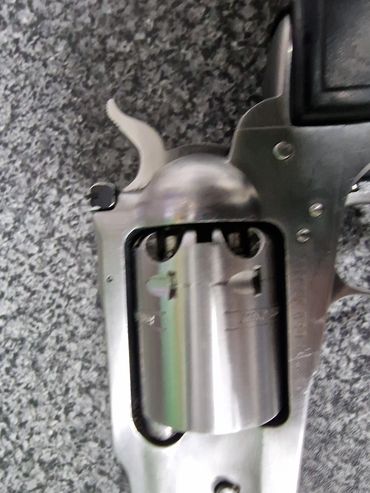 Close-up of a revolver cylinder and hammer.