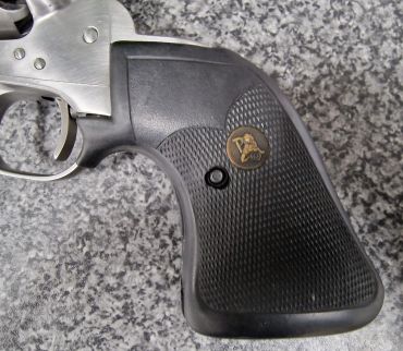 Close-up of a Colt revolver grip.