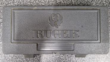 Black Ruger gun case on a gray surface.