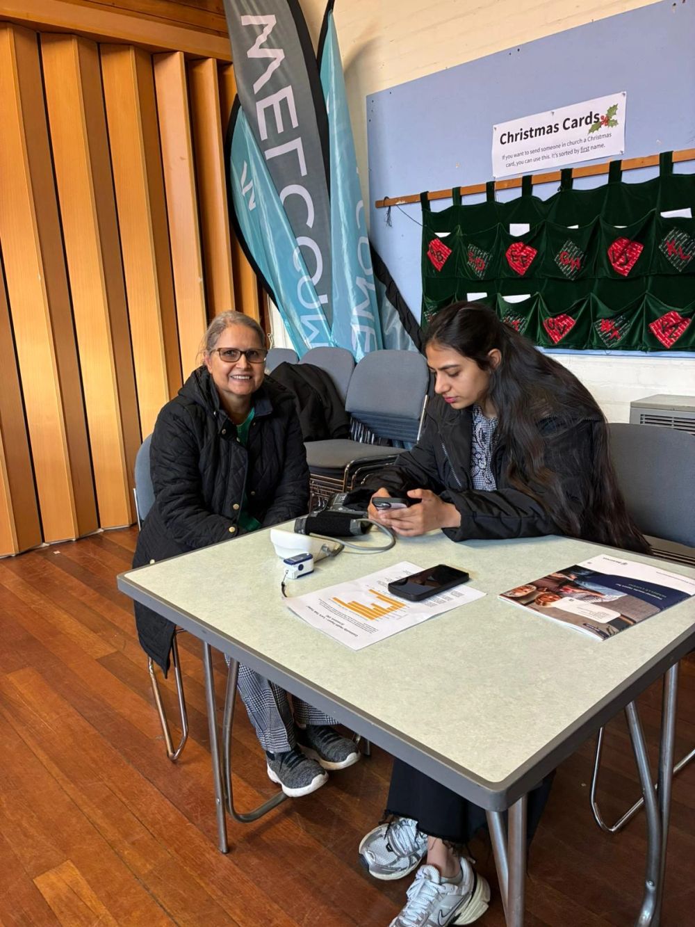 A Lets-Talk2day community wellbeing group session with participants sitting together in conversation.