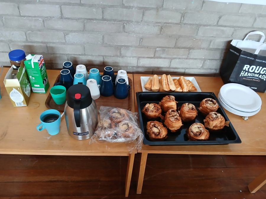 UMEED dementia support session with refreshments and conversation in multiple languages.