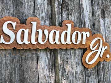 This cut name design has a backer with the letters attached.  One or two names, $2 per width inch.