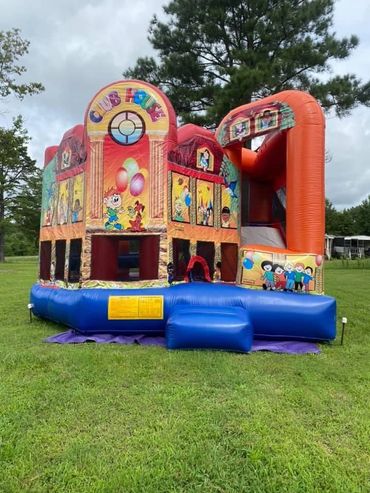 Club house combo unit! Bounce area, ball hoop, and slide inside.  